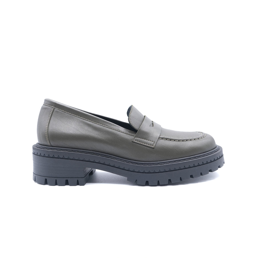 Camo green loafer shoe with a thick black sole on a white background